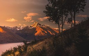 Preview wallpaper mountains, sunset, lake, grass, new zealand