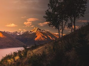 Preview wallpaper mountains, sunset, lake, grass, new zealand