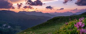 Preview wallpaper mountains, sunset, landscape, slopes, grass, flowers