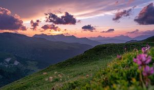 Preview wallpaper mountains, sunset, landscape, slopes, grass, flowers
