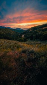 Preview wallpaper mountains, sunset, lawn, grass, landscape