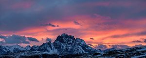 Preview wallpaper mountains, sunset, peaks, snowy, sky, clouds, italy