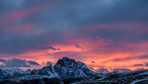 Preview wallpaper mountains, sunset, peaks, snowy, sky, clouds, italy