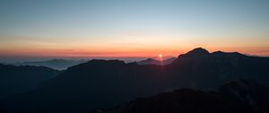 Preview wallpaper mountains, sunset, sky, peaks, aerial view