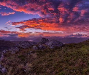 Preview wallpaper mountains, sunset, stones, grass, clouds, landscape