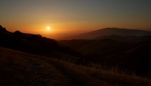 Preview wallpaper mountains, sunset, sun, dusk, evening, dark