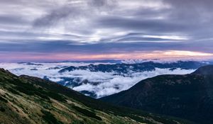 Preview wallpaper mountains, top, clouds, sunset, sky, porous