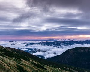 Preview wallpaper mountains, top, clouds, sunset, sky, porous