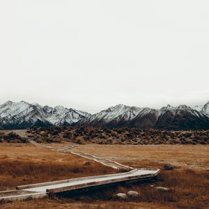 Preview wallpaper mountains, trail, grass, sky