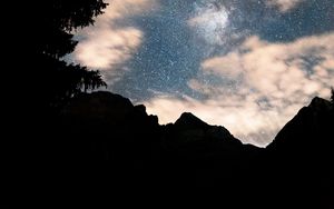 Preview wallpaper mountains, tree, starry sky, silhouette, dark