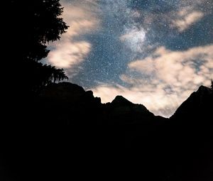Preview wallpaper mountains, tree, starry sky, silhouette, dark