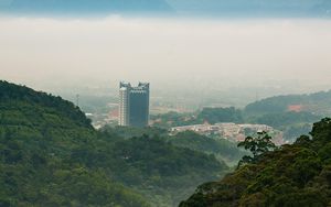 Preview wallpaper mountains, trees, buildings, nature