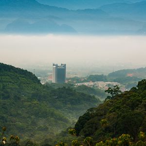 Preview wallpaper mountains, trees, buildings, nature