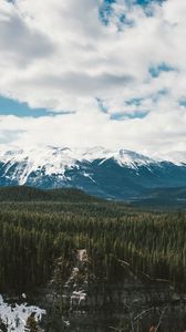 Preview wallpaper mountains, trees, distance, snow, clouds