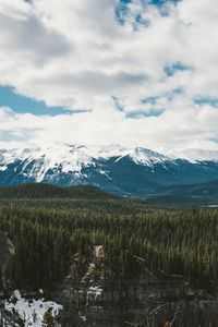 Preview wallpaper mountains, trees, distance, snow, clouds