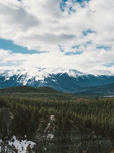 Preview wallpaper mountains, trees, distance, snow, clouds