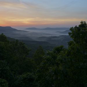 Preview wallpaper mountains, trees, fog, dusk, landscape