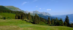 Preview wallpaper mountains, trees, grass, lawn, landscape