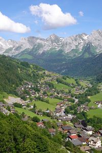 Preview wallpaper mountains, trees, houses, village, landscape, aerial view