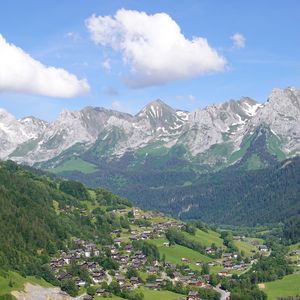 Preview wallpaper mountains, trees, houses, village, landscape, aerial view