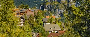 Preview wallpaper mountains, trees, houses, roofs, nature