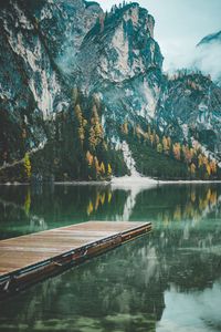 Preview wallpaper mountains, trees, lake, pier, reflection, italy