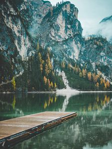 Preview wallpaper mountains, trees, lake, pier, reflection, italy