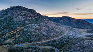 Preview wallpaper mountains, trees, road, sunset