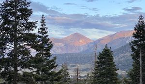 Preview wallpaper mountains, trees, sky, landscape, branches