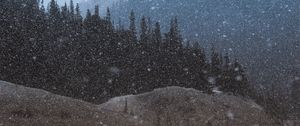 Preview wallpaper mountains, trees, snowfall, landscape, dusk