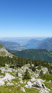 Preview wallpaper mountains, trees, stones, lake, horizon, view, landscape