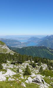 Preview wallpaper mountains, trees, stones, lake, horizon, view, landscape