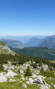 Preview wallpaper mountains, trees, stones, lake, horizon, view, landscape