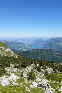 Preview wallpaper mountains, trees, stones, lake, horizon, view, landscape