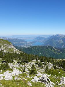 Preview wallpaper mountains, trees, stones, lake, horizon, view, landscape
