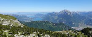 Preview wallpaper mountains, trees, stones, lake, horizon, view, landscape