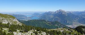 Preview wallpaper mountains, trees, stones, lake, horizon, view, landscape