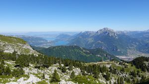 Preview wallpaper mountains, trees, stones, lake, horizon, view, landscape