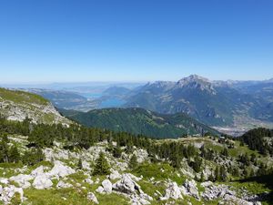 Preview wallpaper mountains, trees, stones, lake, horizon, view, landscape