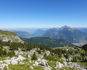 Preview wallpaper mountains, trees, stones, lake, horizon, view, landscape