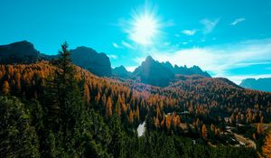 Preview wallpaper mountains, trees, sun, rays, autumn, aerial view