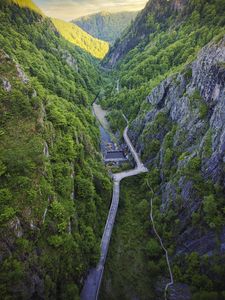 Preview wallpaper mountains, valley, aerial view, road, river