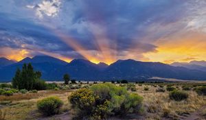 Preview wallpaper mountains, valley, bushes, grass, landscape, sunlight