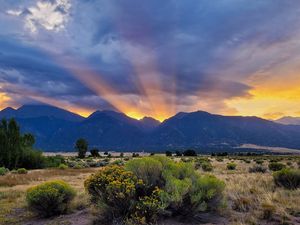 Preview wallpaper mountains, valley, bushes, grass, landscape, sunlight