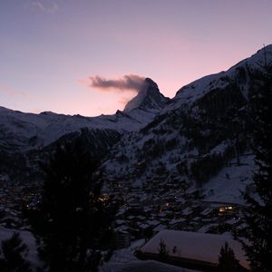 Preview wallpaper mountains, valley, snow, buildings, dusk