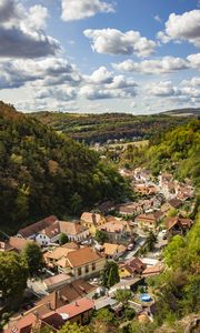 Preview wallpaper mountains, village, buildings, aerial view, valley