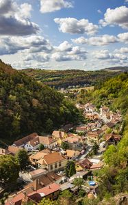 Preview wallpaper mountains, village, buildings, aerial view, valley