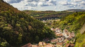 Preview wallpaper mountains, village, buildings, aerial view, valley