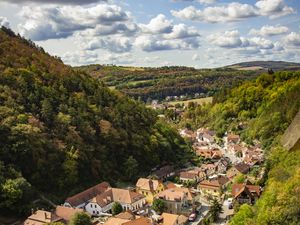 Preview wallpaper mountains, village, buildings, aerial view, valley