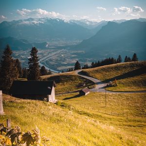 Preview wallpaper mountains, village, landscape, buildings, road